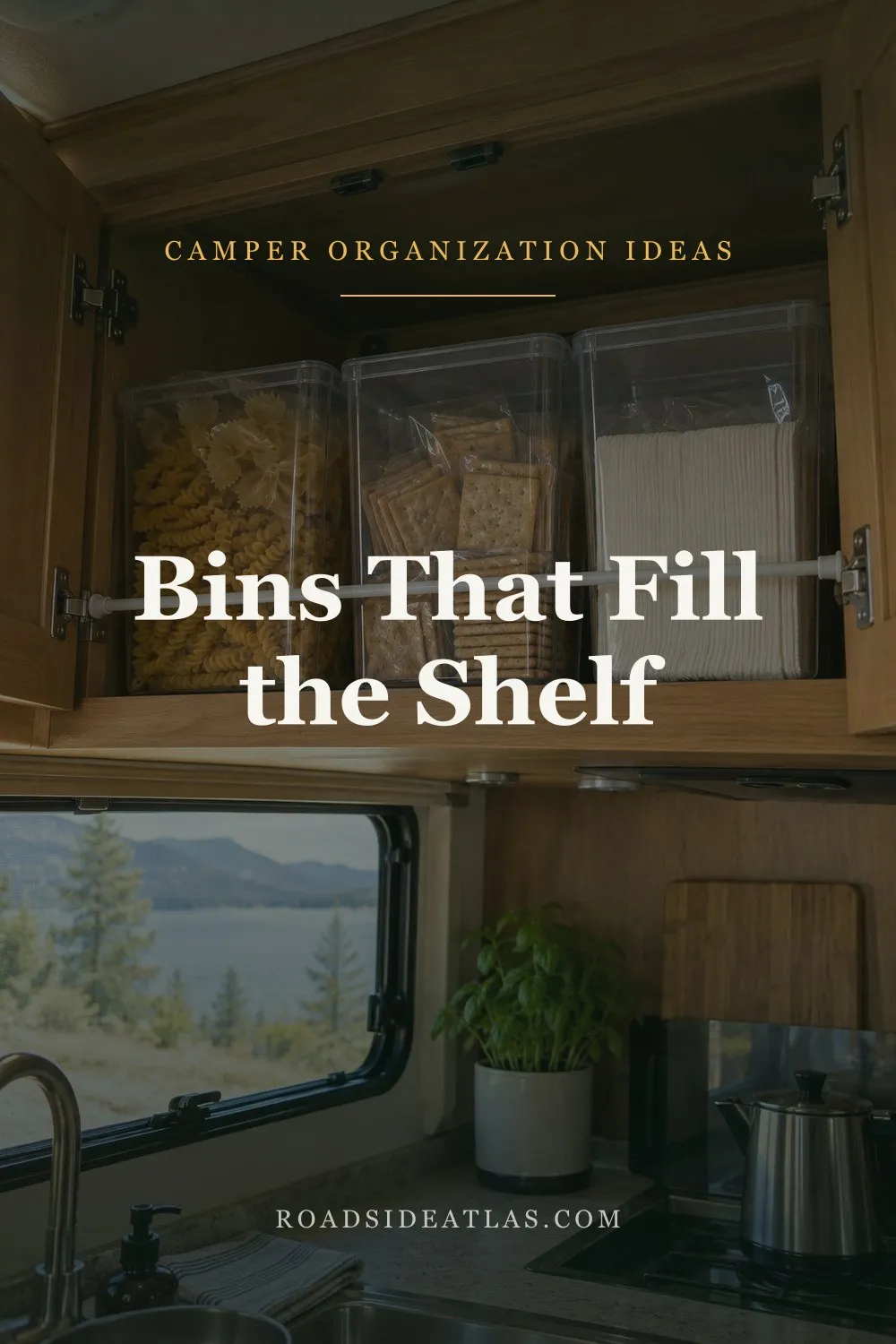 An RV overhead cabinet with clear bins of pasta, crackers and napkins filling the shelf depth, a tension rod across the front